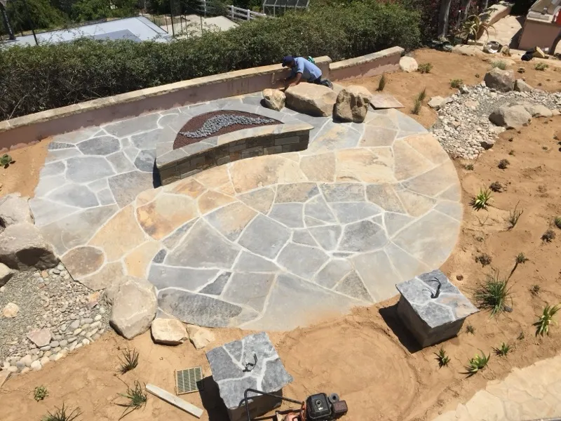 Pacific Landscape Services — flagstone patio and fire pit construction